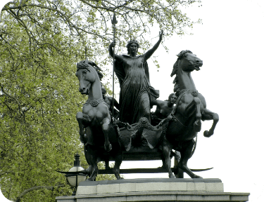 statue of Boudicca holding a spear, standing in a chariot drawn by two rearing horses