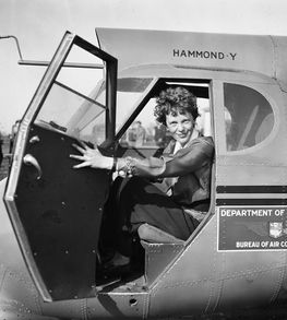 Amelia Earhart in a plane cockpit