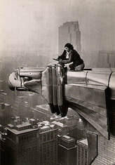 print of Margaret Bourke-White taking a photo high above a city skyline